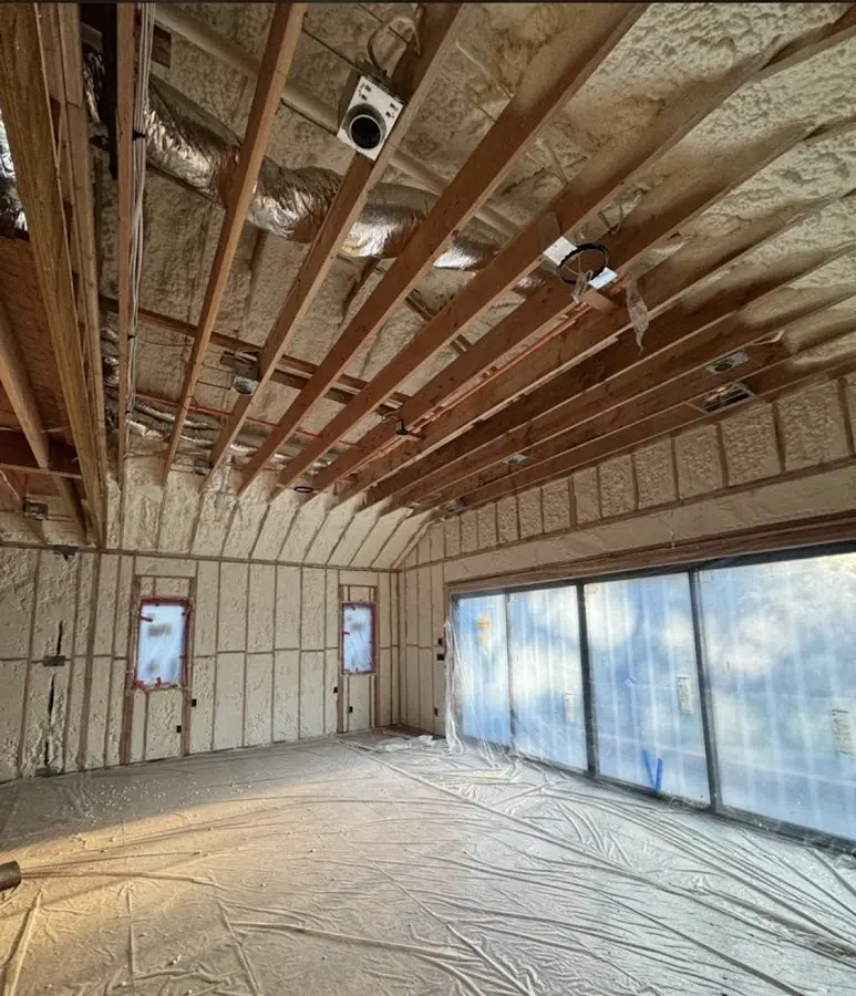 Interior walls and ceiling insulated with spray foam during new construction in Ankeny